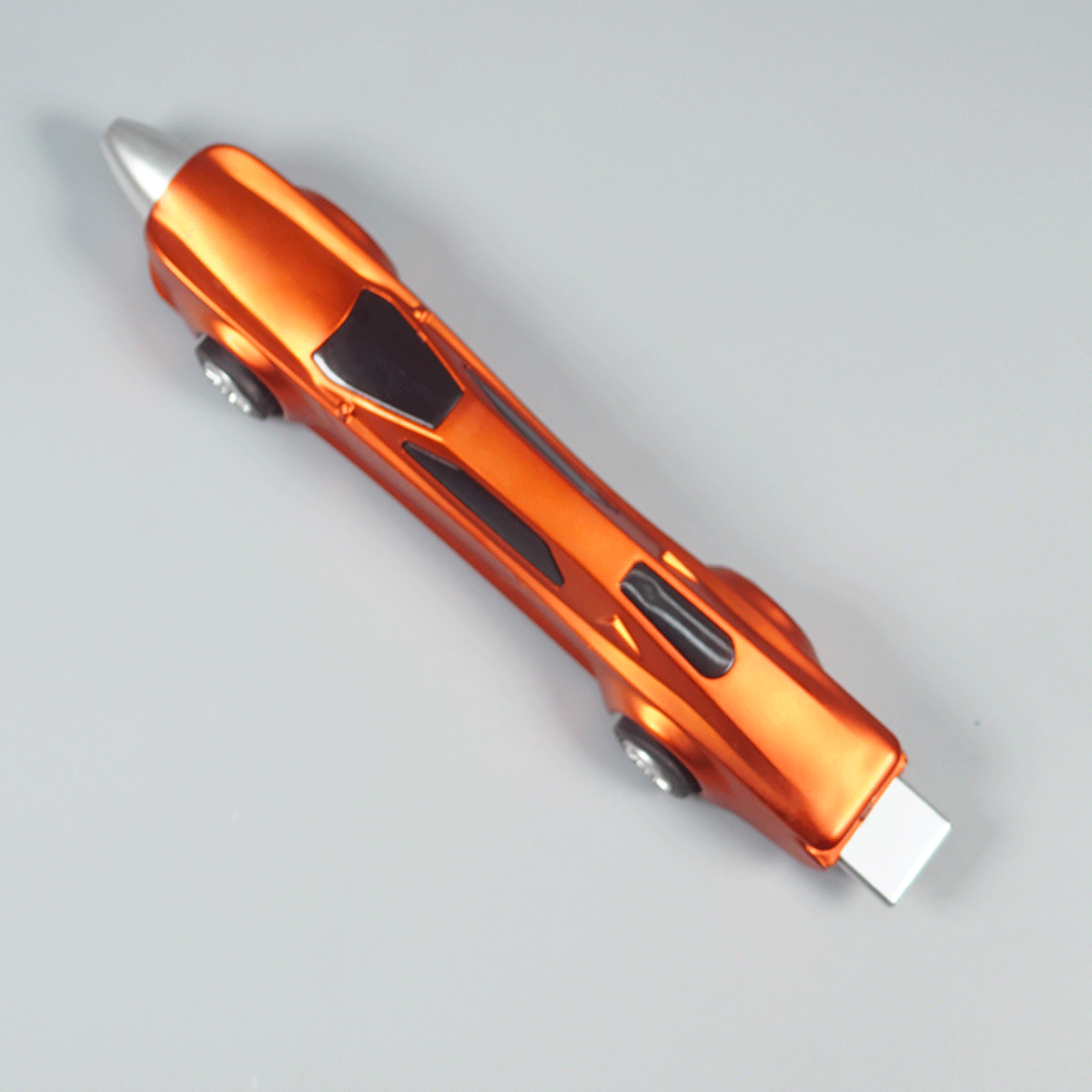 penhouse.in pens Orange And Silver Color Body Racing Car Shaped Shiny Plastic And Working Wheels Fine Tip Ball Pen SKU 10375