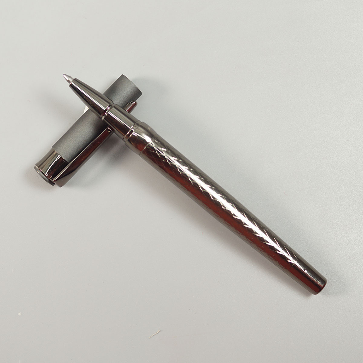 Swiss Cross 1001 Gun Metal Color Body And Grey Color Cap And Fine Tip Roller Ball Pen SKU 10560