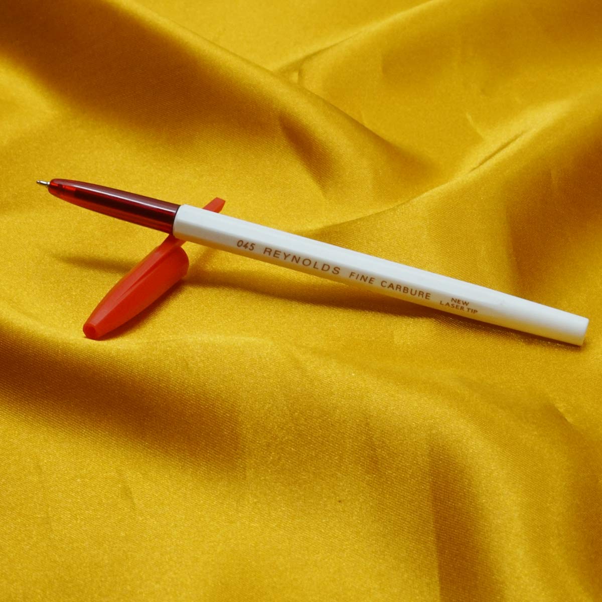 Reynolds 045  Fine carbure white body with Red Cap Type Ball Pen  SKU 11986