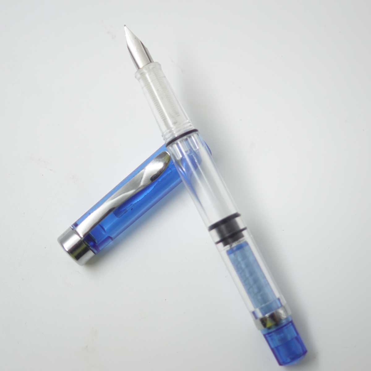 Luoshi 360A Transparent Blue Color Body With Silver Clip EF Nib Piston Type Fountain Pen SKU 25203