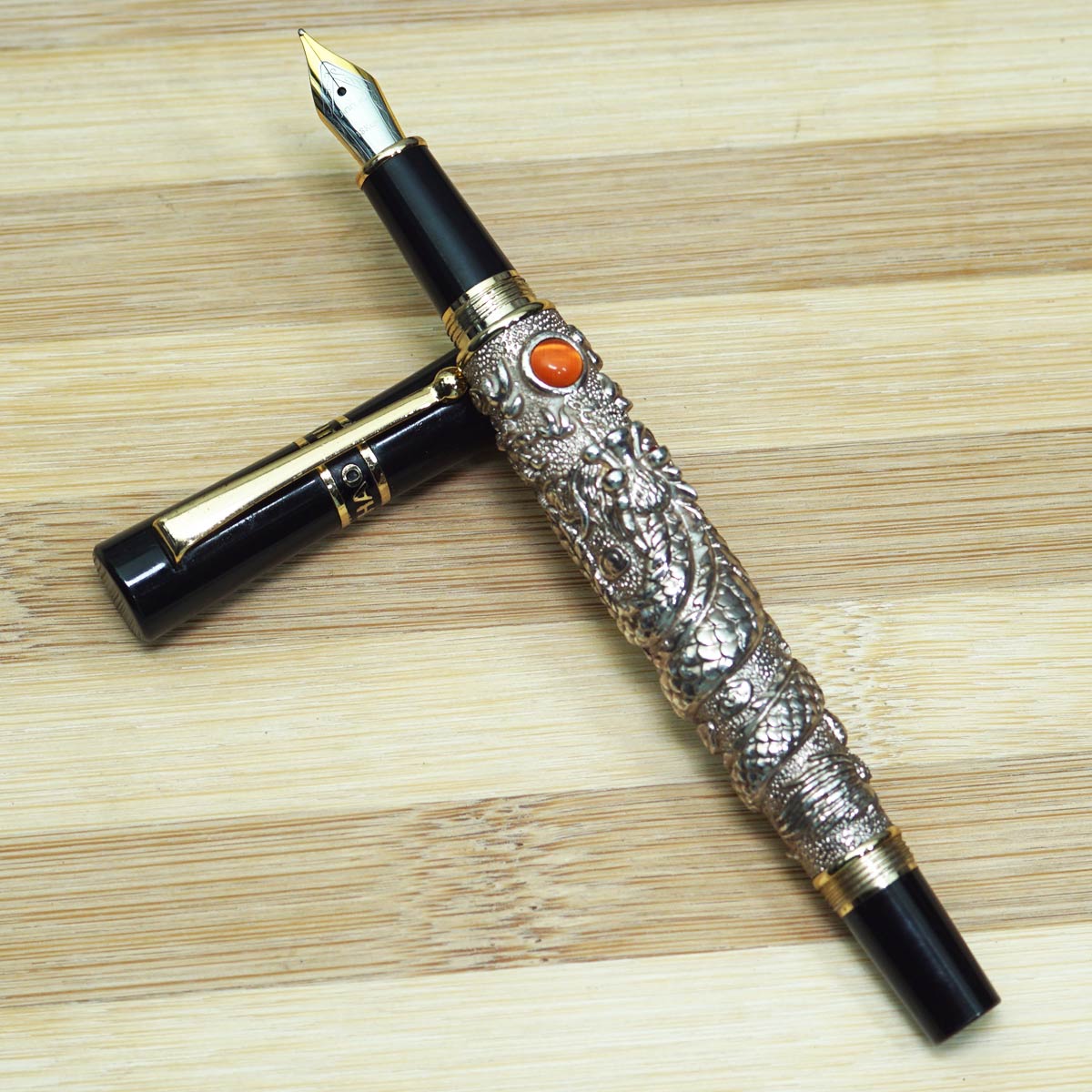 jinhao Dragon Silver Color Body With Black Color Cap and Orange Stone on Body Medium Nib Converter Type Fountain Pen SKU 14263