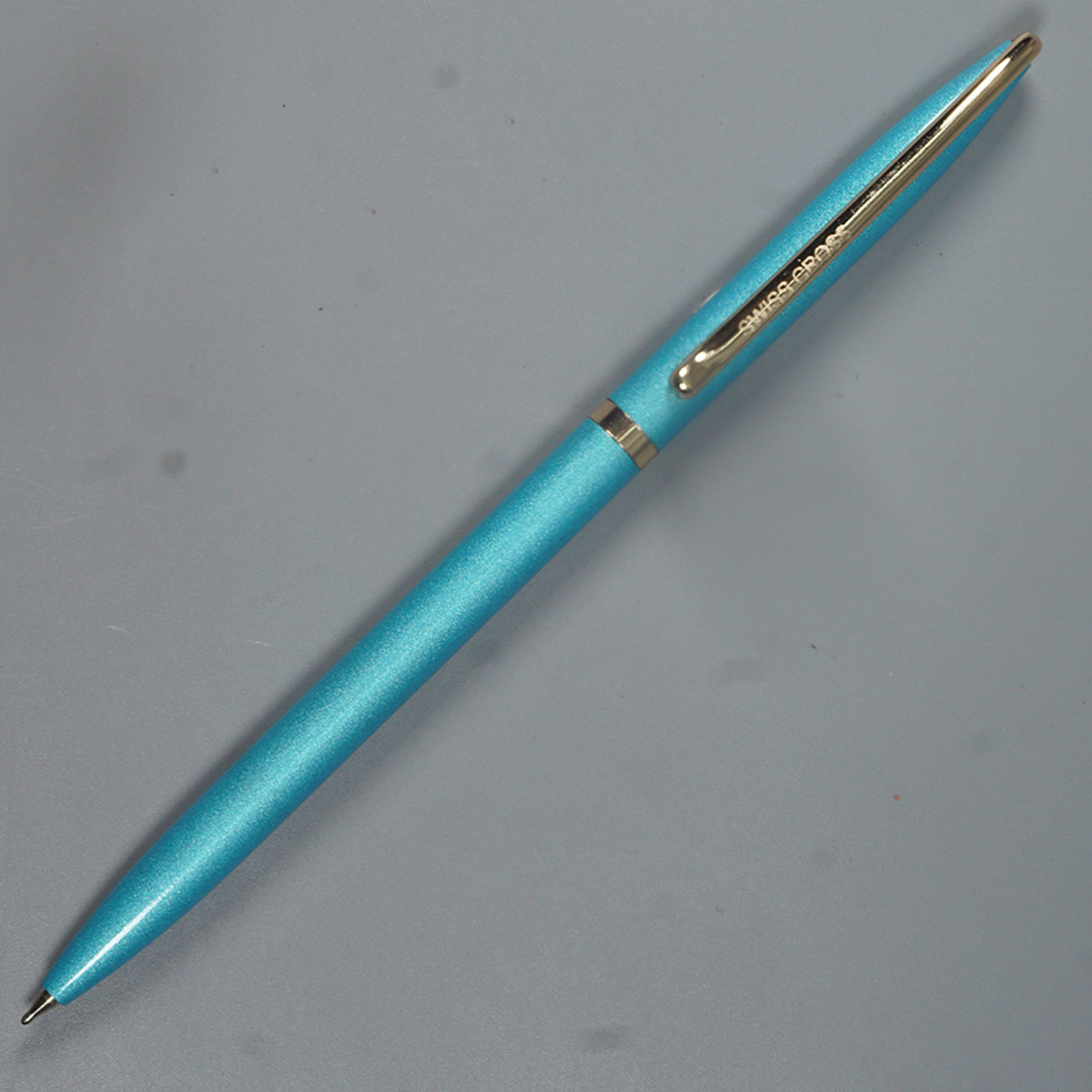 Swiss Cross 929 Glossy Sky Blue Color Body And Gold Color Trim And Clip Fine Tip Twist Type Ball Pen SKU 14586