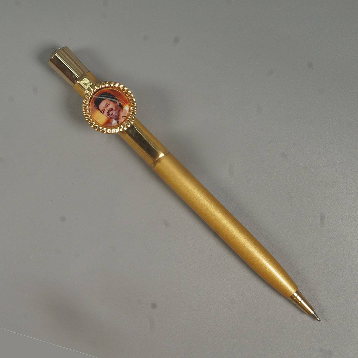 penhouse.in Pens CM Vijay Printed Gold Color Body With Top On Stone Twist Type Ball Pen SKU 14612