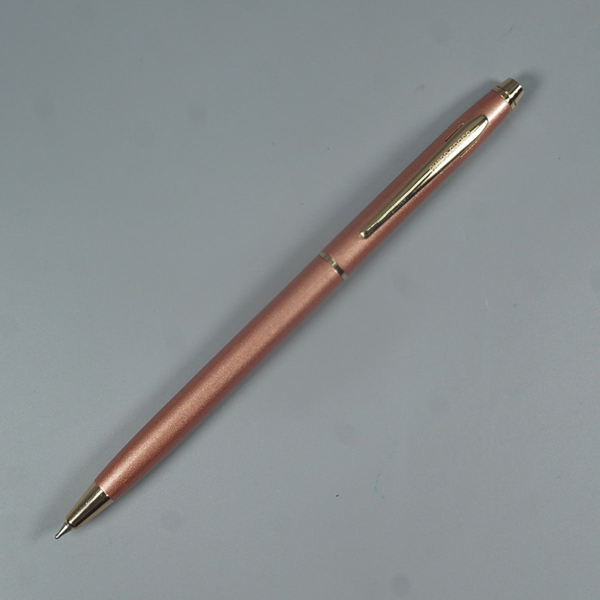 Swiss Cross 1002 Rose Gold Color Body With Gold Color Clip Twist Type Ball Pen SKU 14645