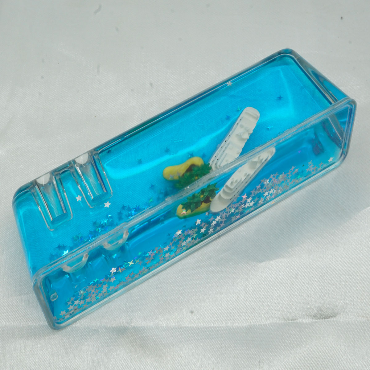 penhouse.in  Decorative Acrylic Pen Holder Liquid Motion Paper weight Or Dashboard Accessory With A nautical Theme SKU 51731