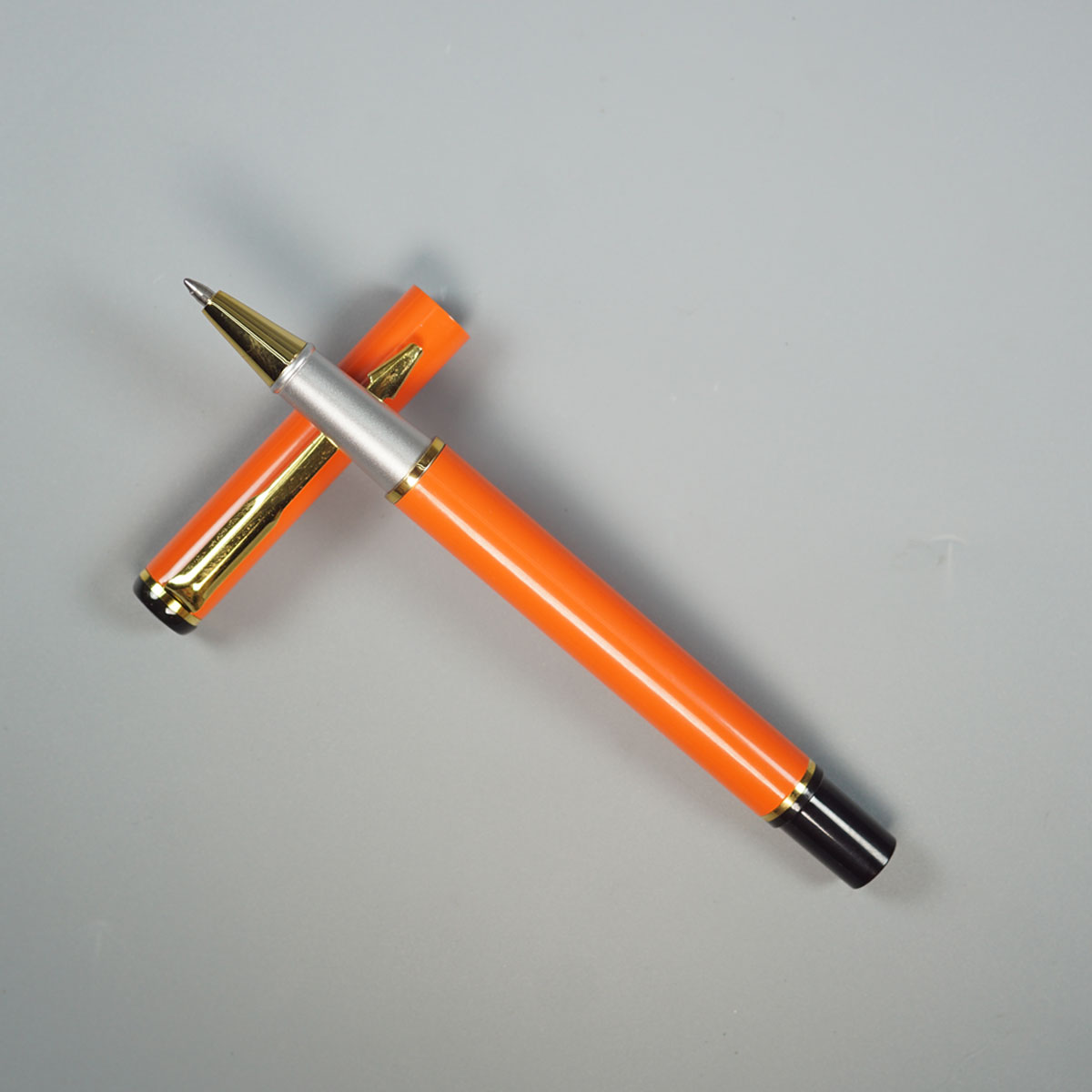Penhouse.in Orange Color Body With Gold Clip Cap Type Roller Ball Pen SKU 19574