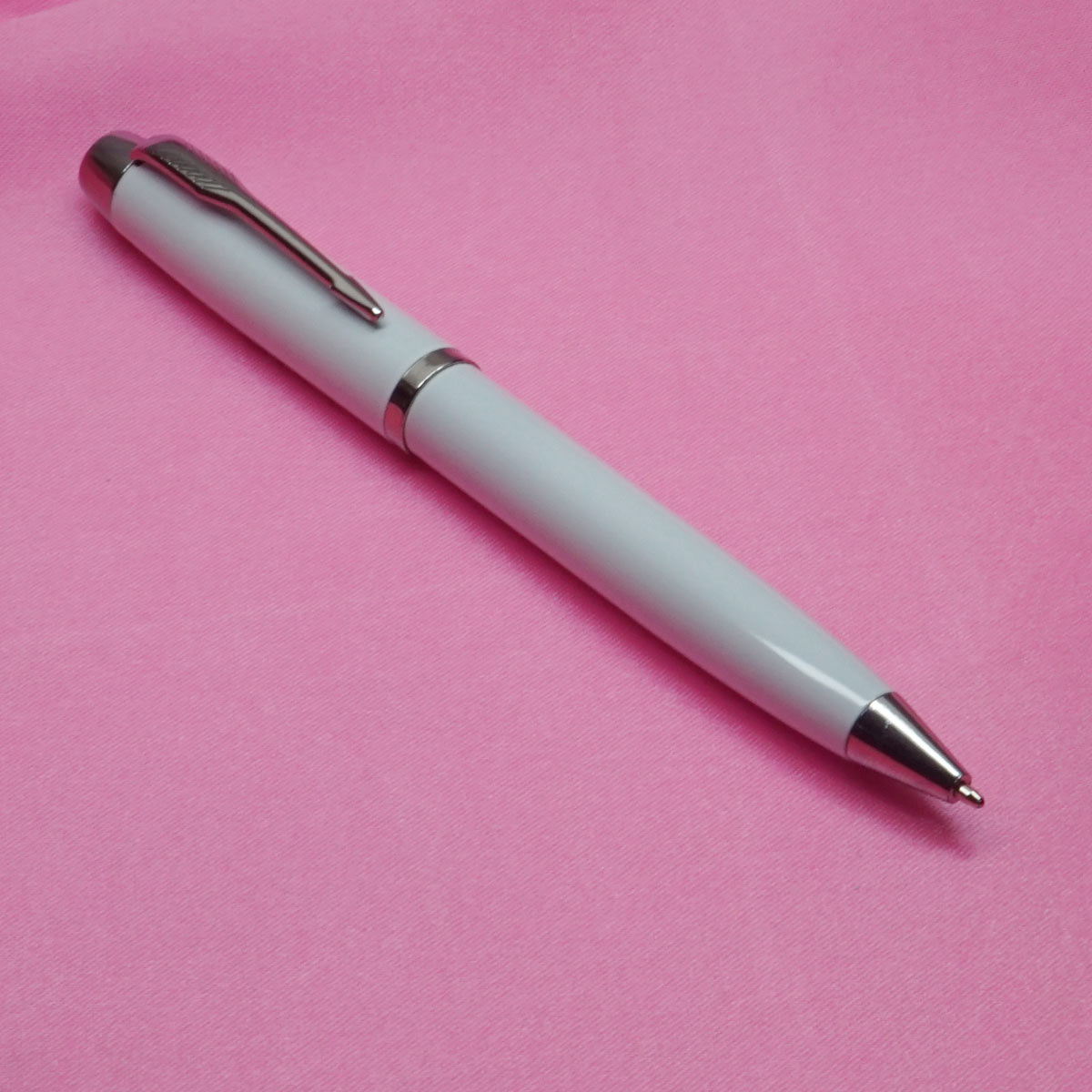 penhouse.in White  Body and Cap with Silver Trims  Medium Point  Twist Ball pen SKU 20687