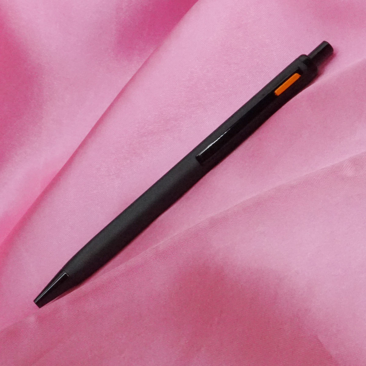 penhouse.in Triangular Mat Black Color Body With Fine Tip Orange Color On Clip Click Type Ball Pen SKU 21264