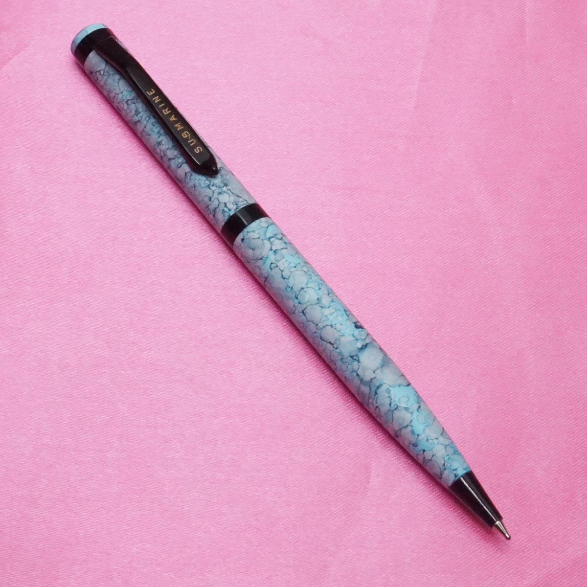 Submarine 993 Sky Blue Color Marble Design Pattern Body With Fine Tip Black Trim Twist Type Ball Pen SKU 21727