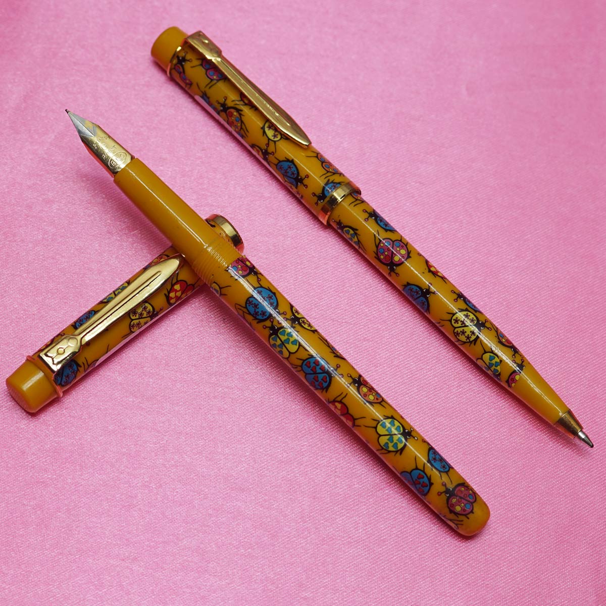 Alpha Yellow Color Body with color Beetles design on the body and cap Eye Dropper Model Fountain Pen and Ball Pen Set SKU 22220