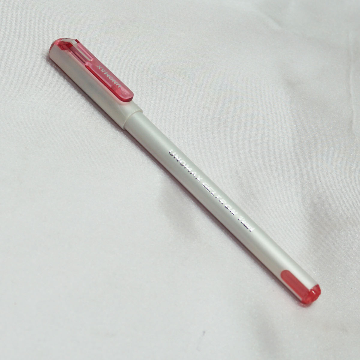 Unomax Geltron Pearl White Color Body With Red Clip Red Writing Fine