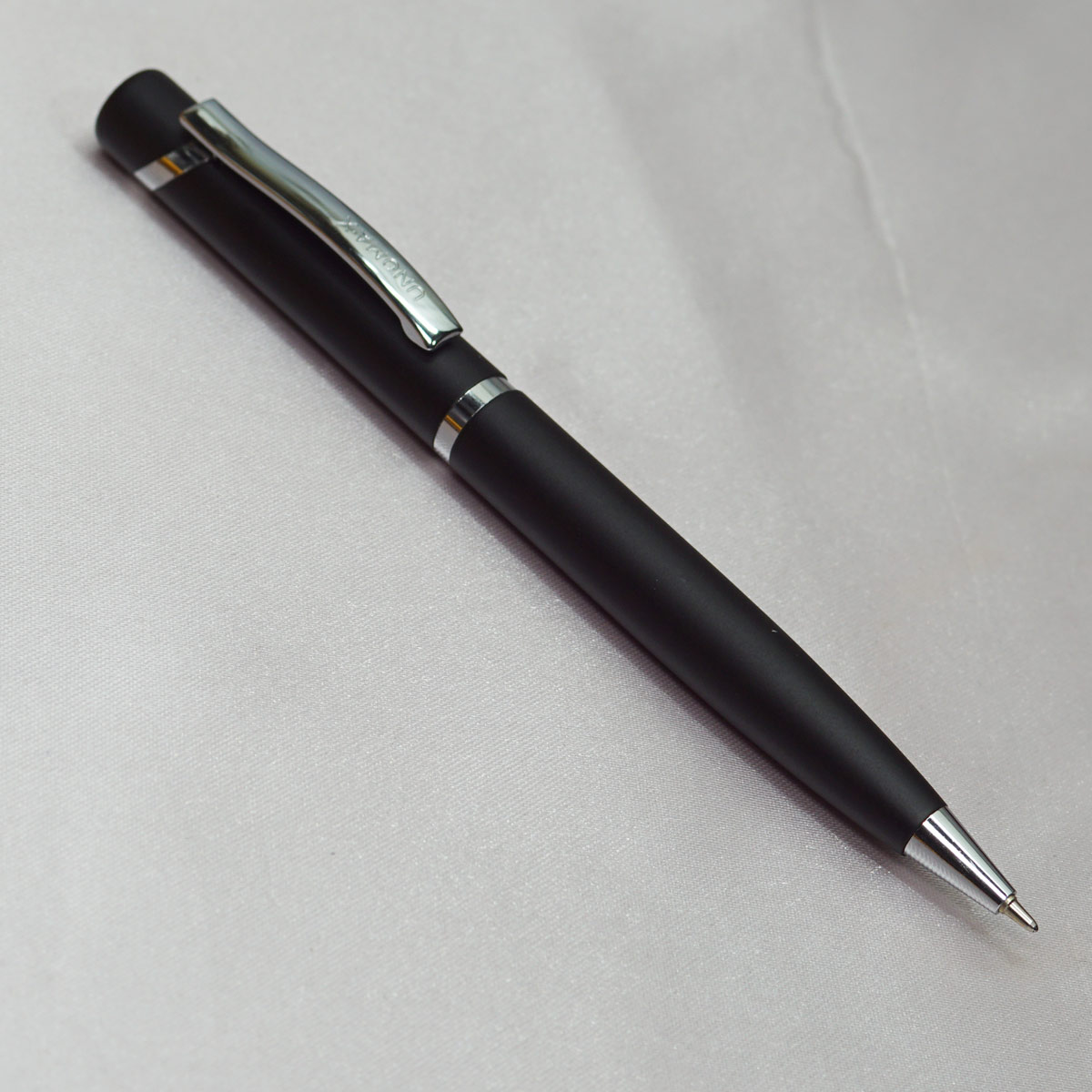 Unomax OPTIMA Black Color Body With Silver Clip Fine Tip Twist Type Ball Pen SKU 22522