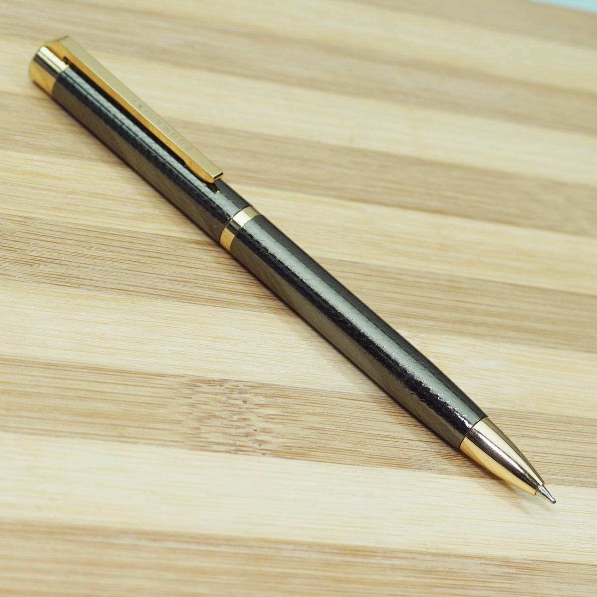 Submarine 1069 Glossy Gun Metal Finish Body With Golden Color Clip Fine Tip Twist Type Ball Pen SKU 22755