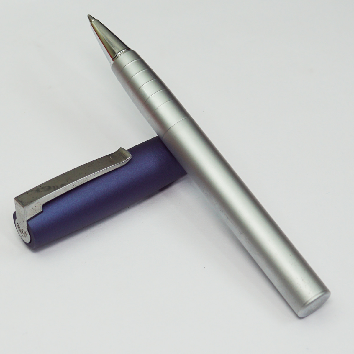 Faber Castell Silver Body With Blue Cap Medium Tip Roller Ball Pen SKU 23005