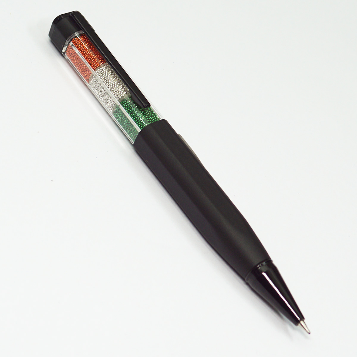 Penhouse.in Mat Black Hexagon Shape Body With Tri Flag Color Beats Filled Cap Stone On Top Twist Type Ball Pen  SKU 23252