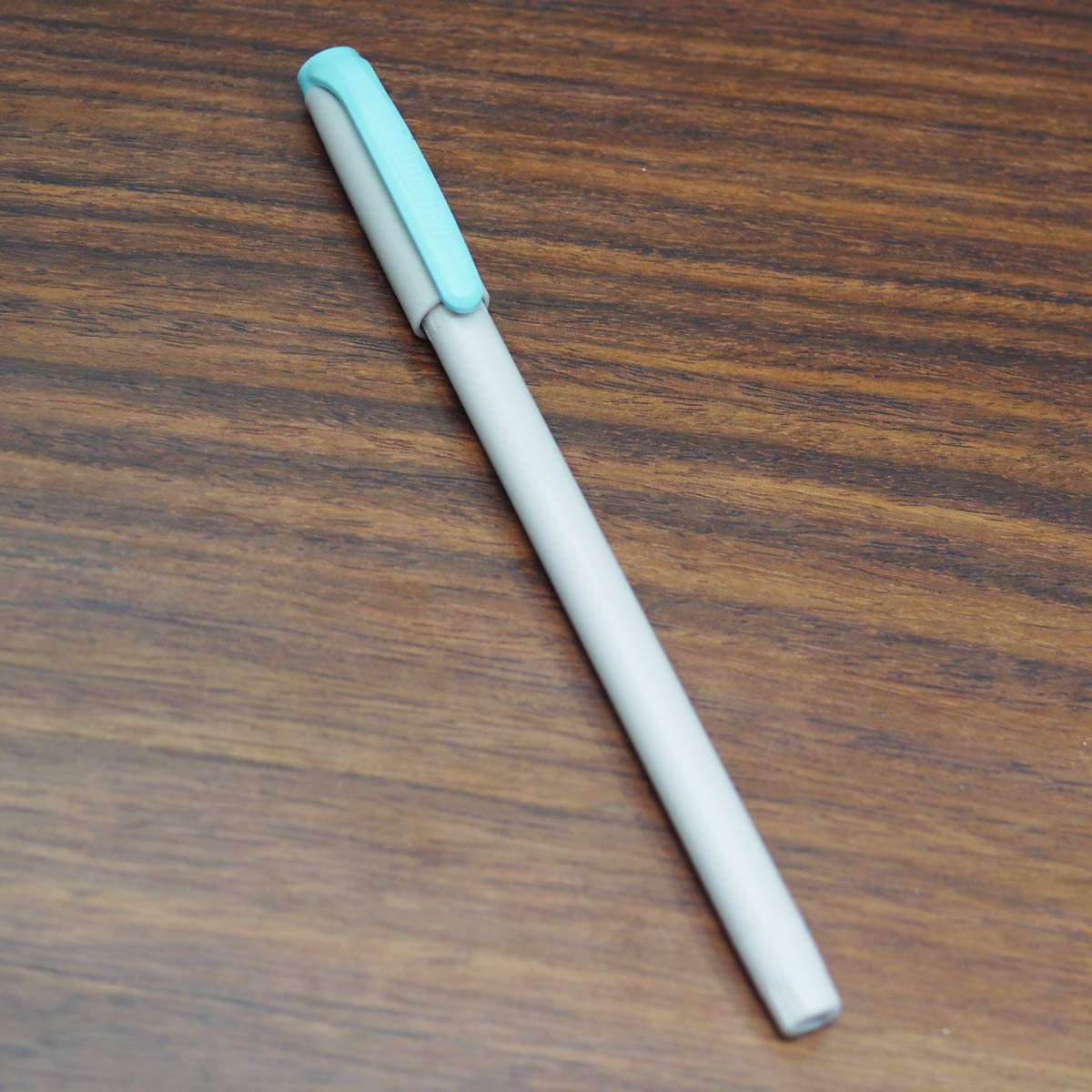 Hauser Q10 Cream Color Body With Blue Color Cap Fin Tip Blue Writing Cap Type Ball Pen SKU 23496