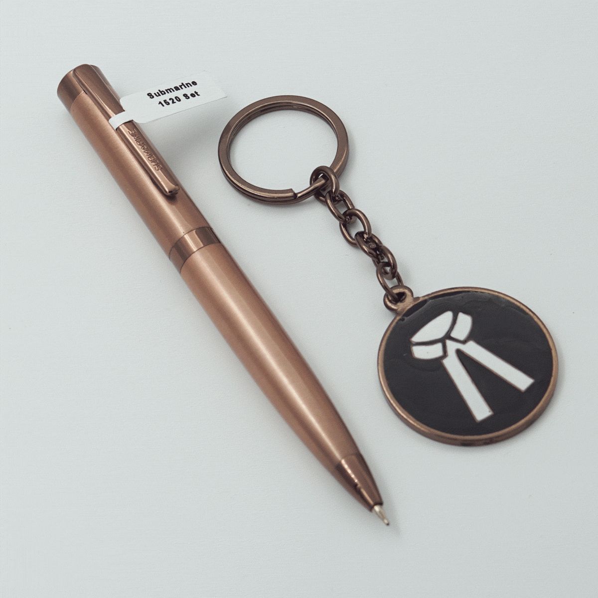 Submarine 1520 Copper Color Body With Cap Fine Tip Twist Type Ball Pen And Advocate Symbol Keychain Set SKU 23707