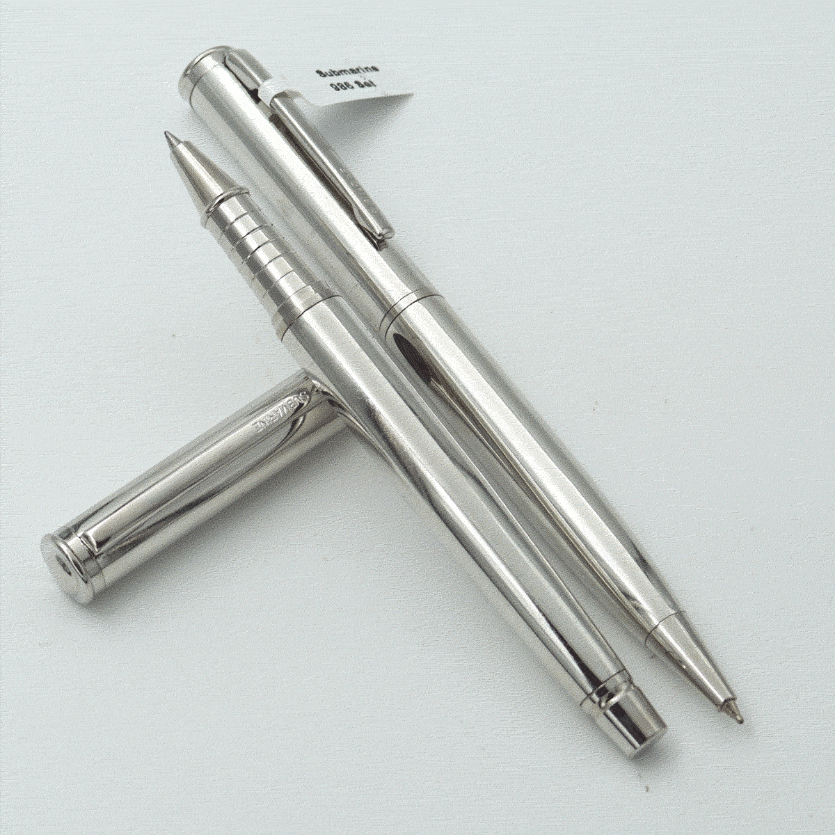 Submarine 986 Full Silver Color Body With Silver Color Cap Roller Ball And Twist Type Ball Pen Set SKU 23773