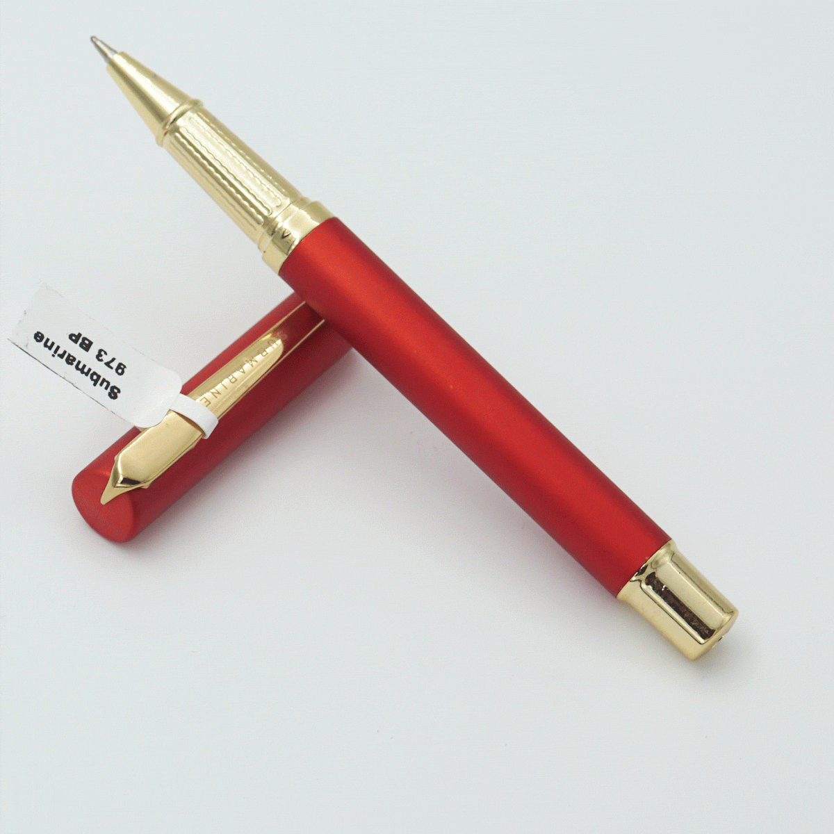 Submarine 973 Red Color Body With Cap And Golden Color Clip Fine Tip Cap Type Ball Pen SKU 23812