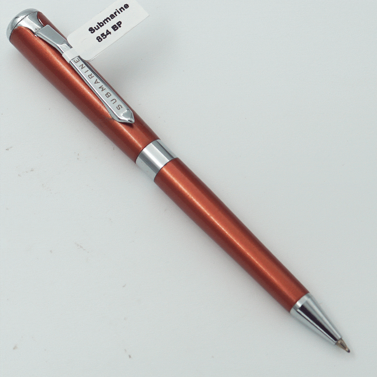 Submarine 854 GEMINI Orange Color Body With Silver Trims And Silver Clip Fine Tip Twist Type Ball Pen SKU 23918