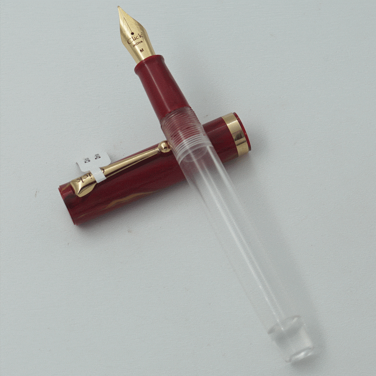 Click Orion Transparent Body With Red Color Marble Cap And Gold Clip No
