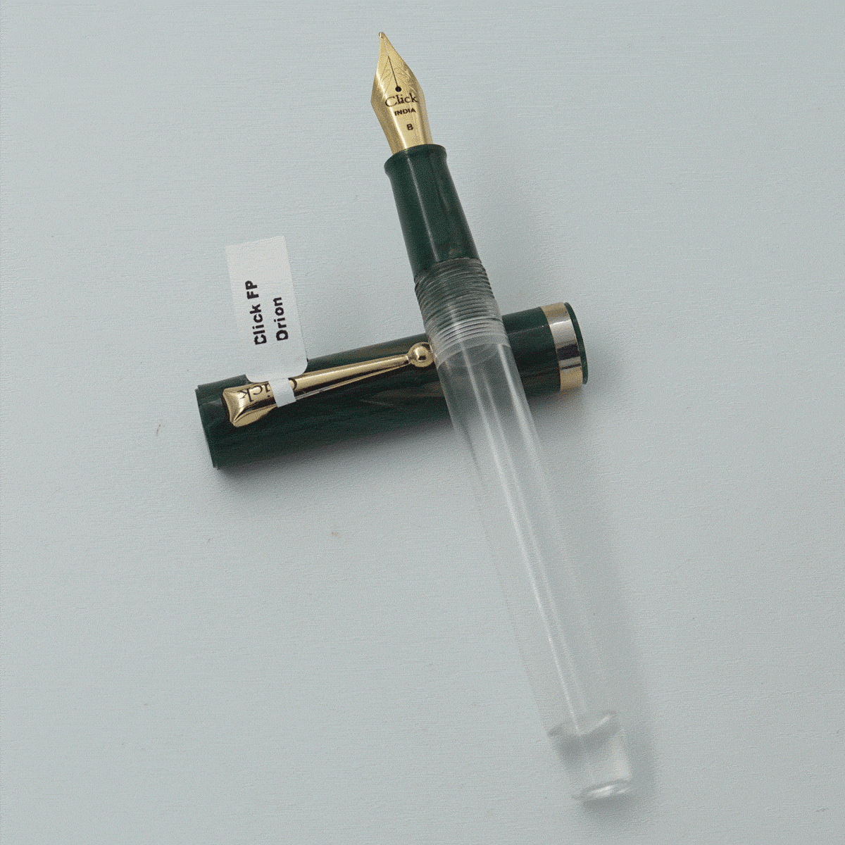 Click Orion Transparent Body With Green Color Marble Cap And Gold Clip