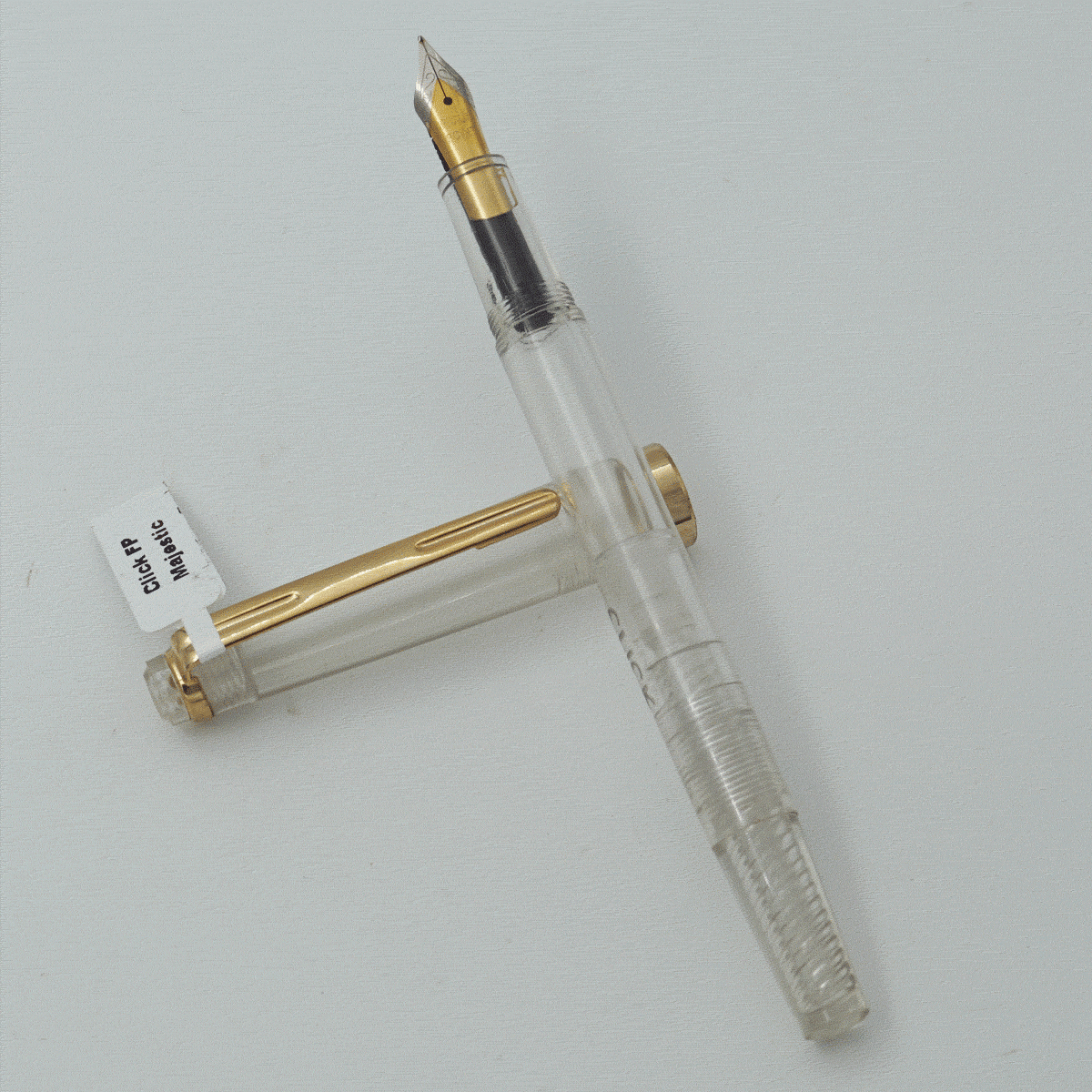Click Majestic Transparent Color Body With Golden Color Clip Fine Nib Piston Type Fountain Pen SKU 24157