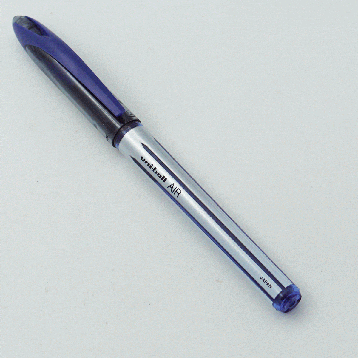 Uniball UBA-188-L AIR White Color Design Body With Blue Clip Cap 0.7mm Tip Blue Writing Roller Ball Pen SKU 24319