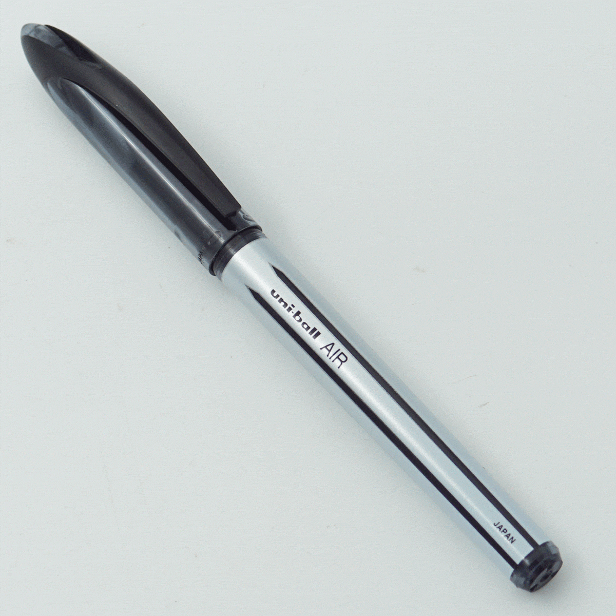 Uniball UBA-188-L AIR White Color Design Body With Black Clip Cap 0.7mm Tip Black Writing Roller Ball Pen SKU 24320