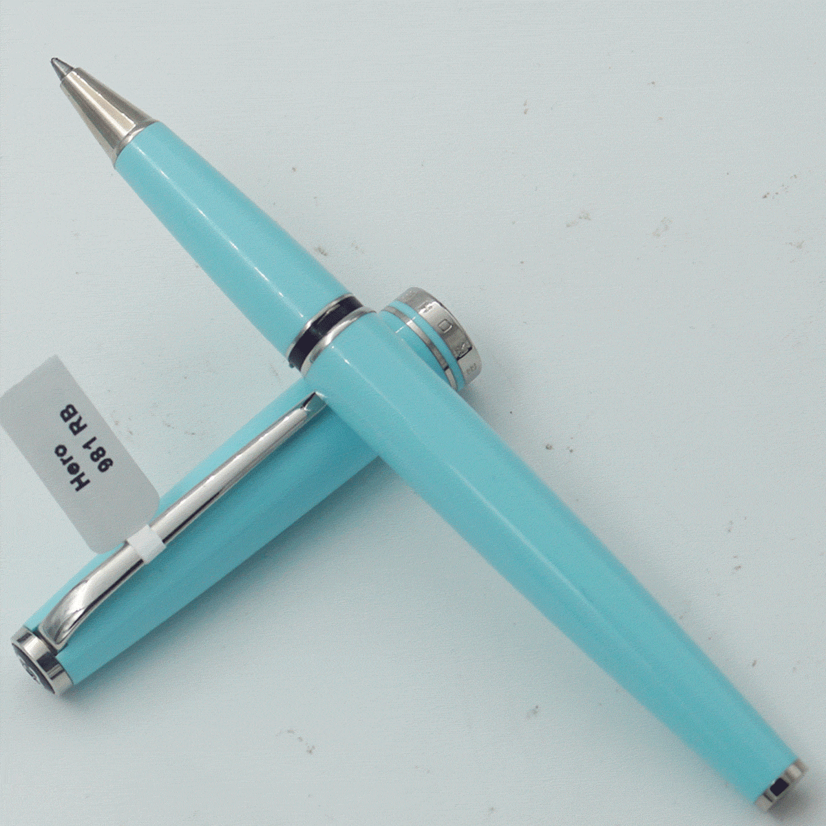 Hero 981 Sky Blue Color Body With Silver Clip Medium Tip Roller Ball Pen SKU 24376