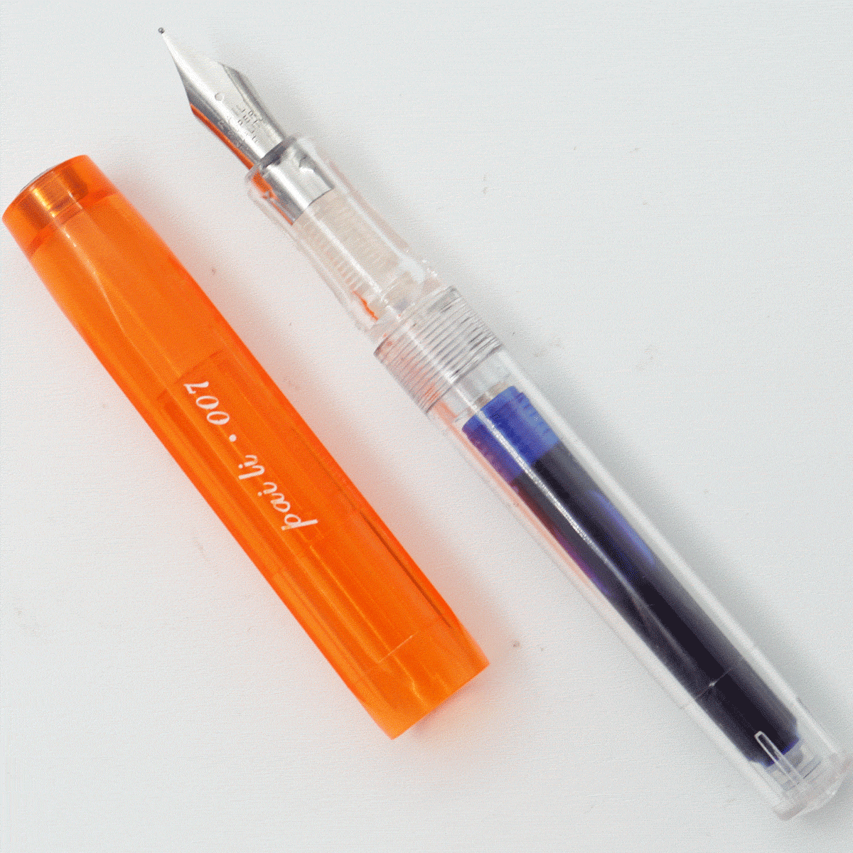 Ledos Paili 007 Tranparent Body With Orange Color Long Cap Fine Nib Cartridge Type Fountain Pen SKU 24422