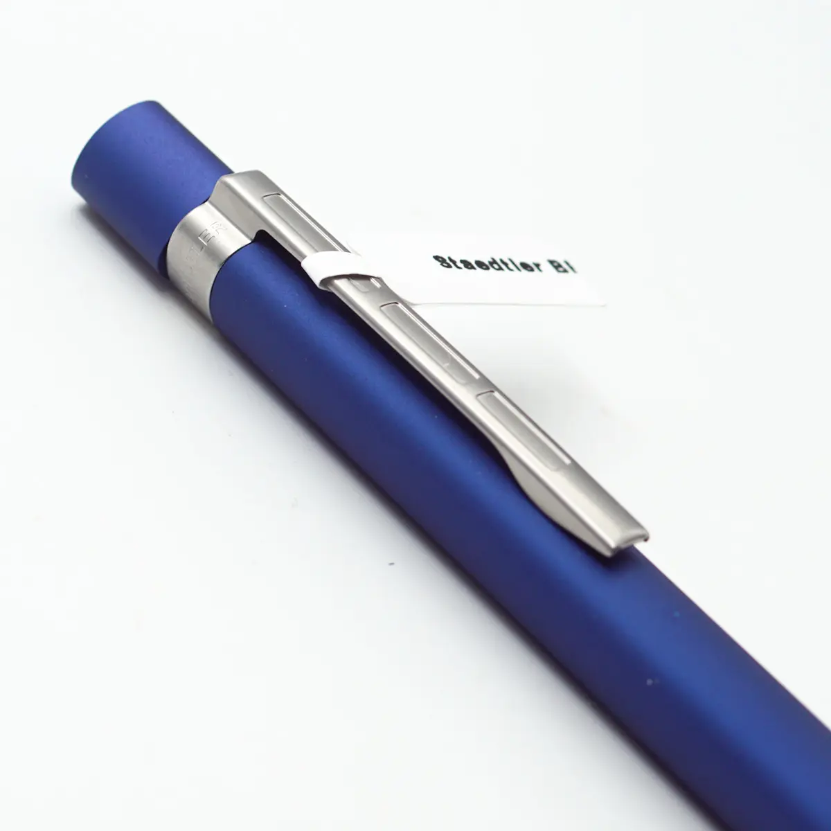 Staedtler Mat Blue color Triangular Body With Velvety Aluminium Surface And  Silver Clip Medium Tip Twist Type Ball Pen SKU 24507
