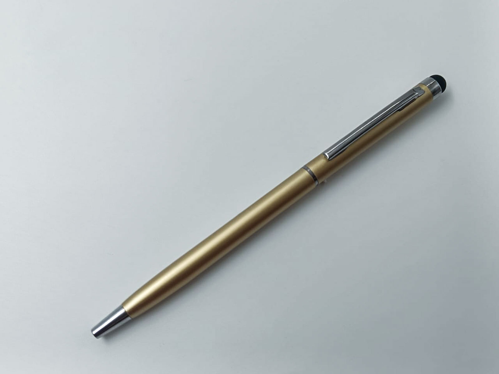 penhouse.in Slim Glossy Finish Gold Color  Body  With Silver Trim  Medium Tip Stylus Twist Type Ball Pen SKU 24975