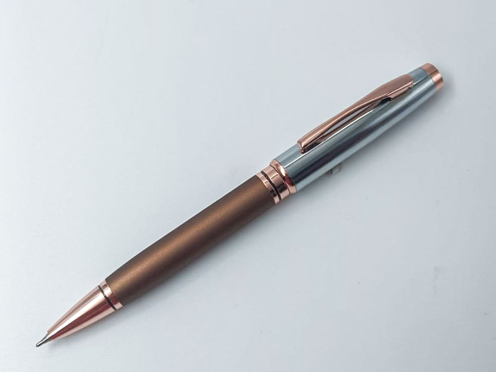 Penhouse.in Silver With Copper Color body And Copper Trim Twist Type Ball Pen  SKU 24978