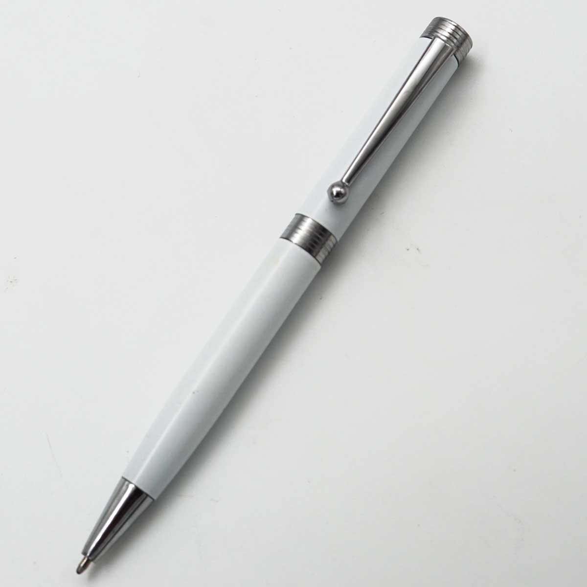 penhouse.in White Color Body With Silver Clip And Trim Medium Tip Twist Type Ball Pen  SKU 25122