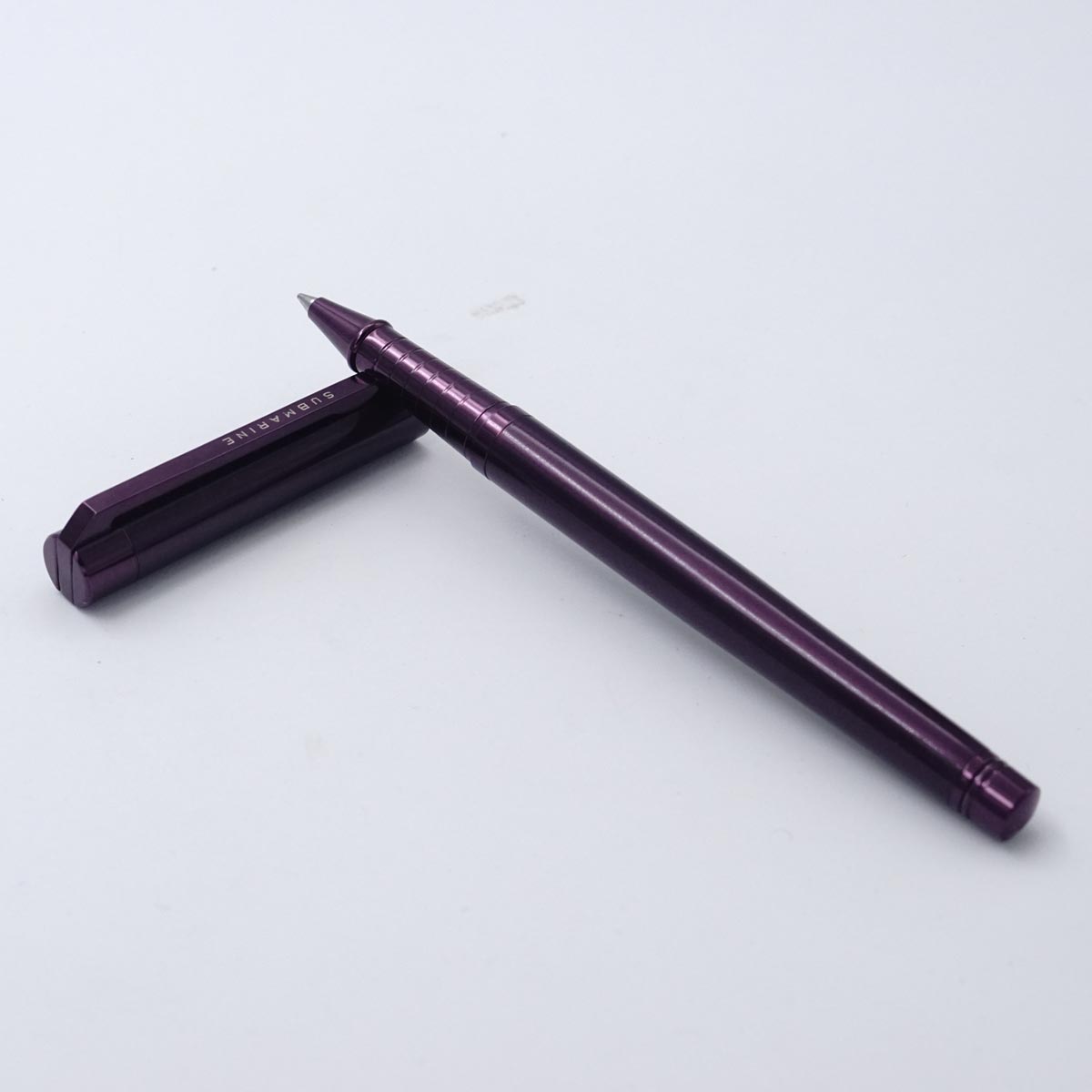 Submarine 1012 Slim Glossy Metallic Purple Color Body With Medum Tip Flat Design Clip Cap Type Roller Ball Pen  SKU 25443