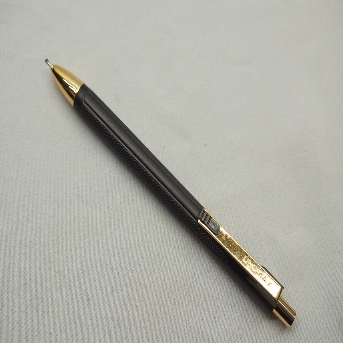 Unomax ClickTron Gold Black Color Body Gold Clip Retractable Ball Pen SKU 27563