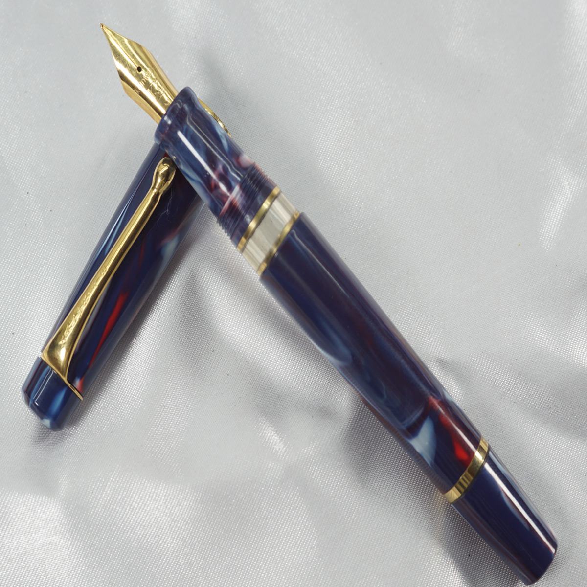 Kanwrite Heritage GT Marble Opq Blue Red Body and Cap Type Gold Clip with Blue Grip Medium Nib Piston Type Fountain Pen SKU 27751
