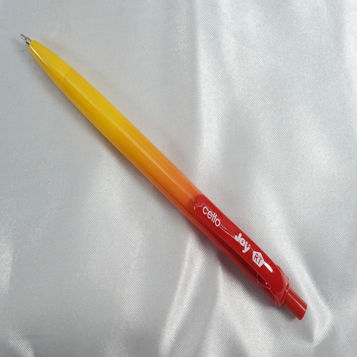 Cello Joy RT Yellow With Red Color Body And Red Color Clip & Red Writing Retractable Type Ball Pen SKU 27930