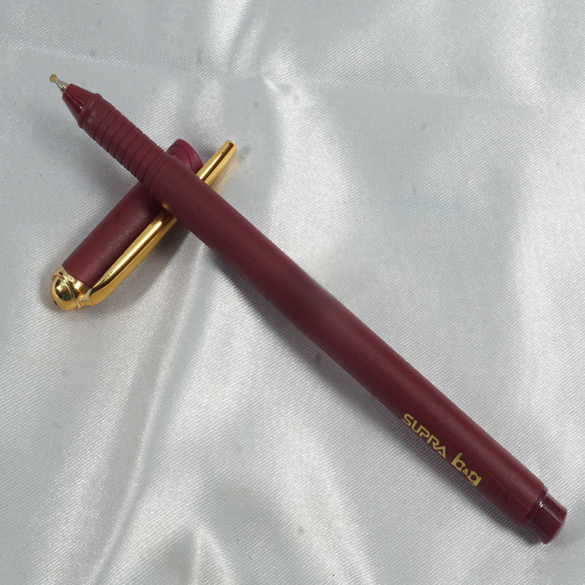 Supra b&g Marrown Color Body With Gold Color Clip And Red Writing Ball Pen SKU 27948