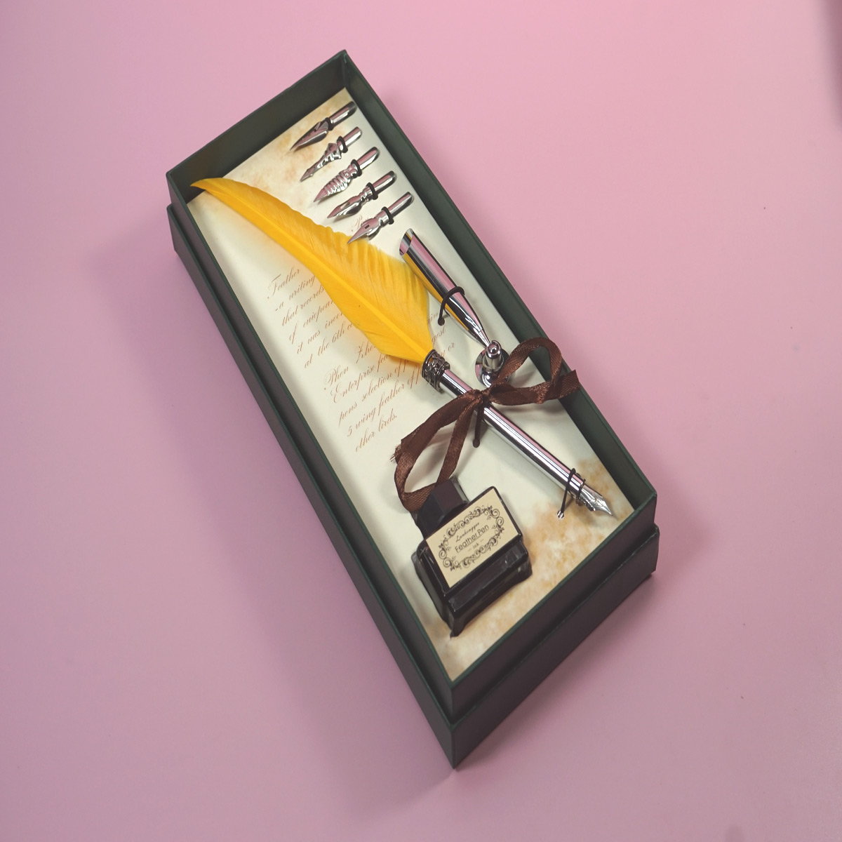 Penhouse.in  Feather Pen Yellow Color Feather Silver Color Grip Calligraphy Writing Dip Pen 5 Nibs Ink Bottle With Silver Stand SKU 28361