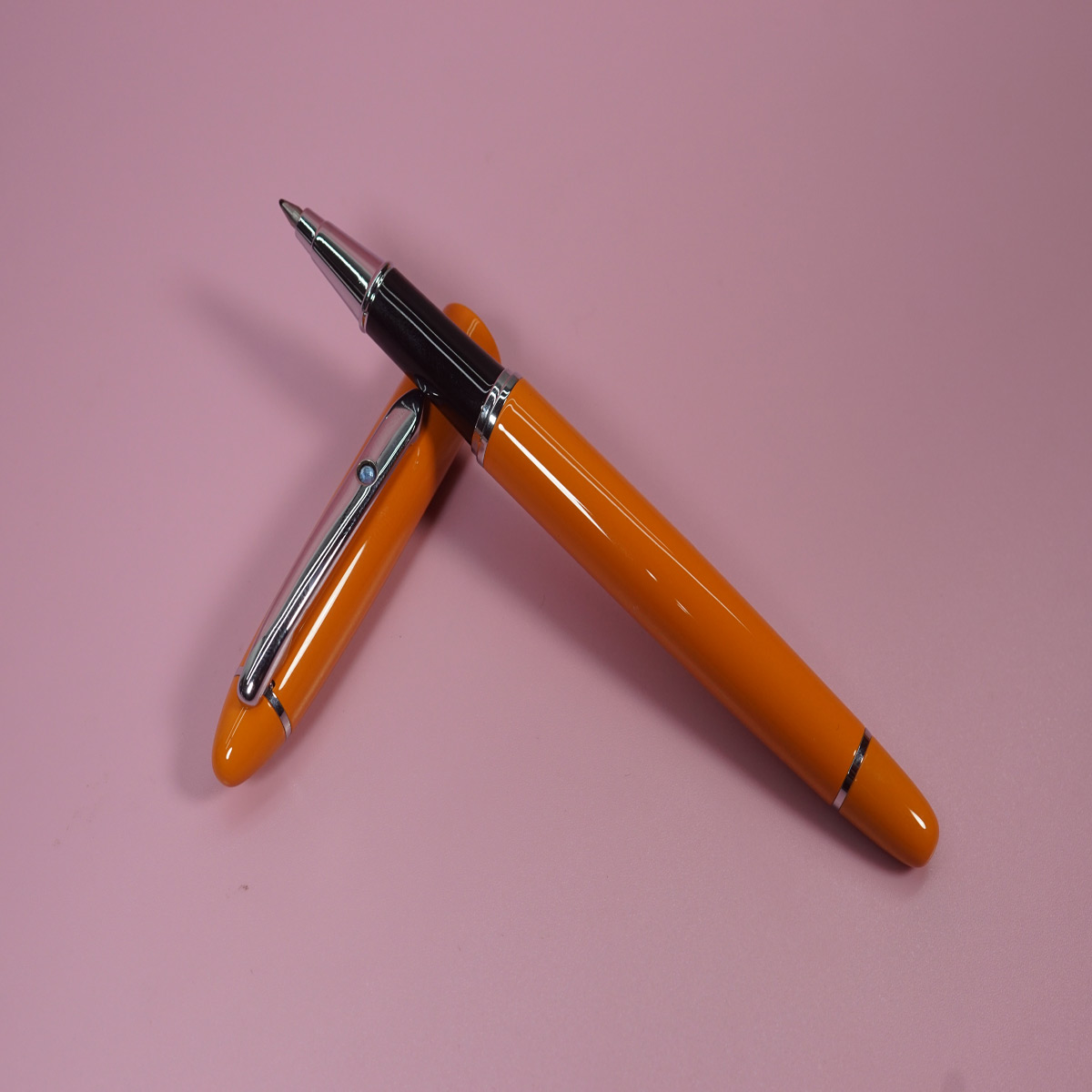 Pimio 608 Glossy Orange Color Body and Cap with Silver Clip On Blue Stone Roller Ball Pen  SKU 28385