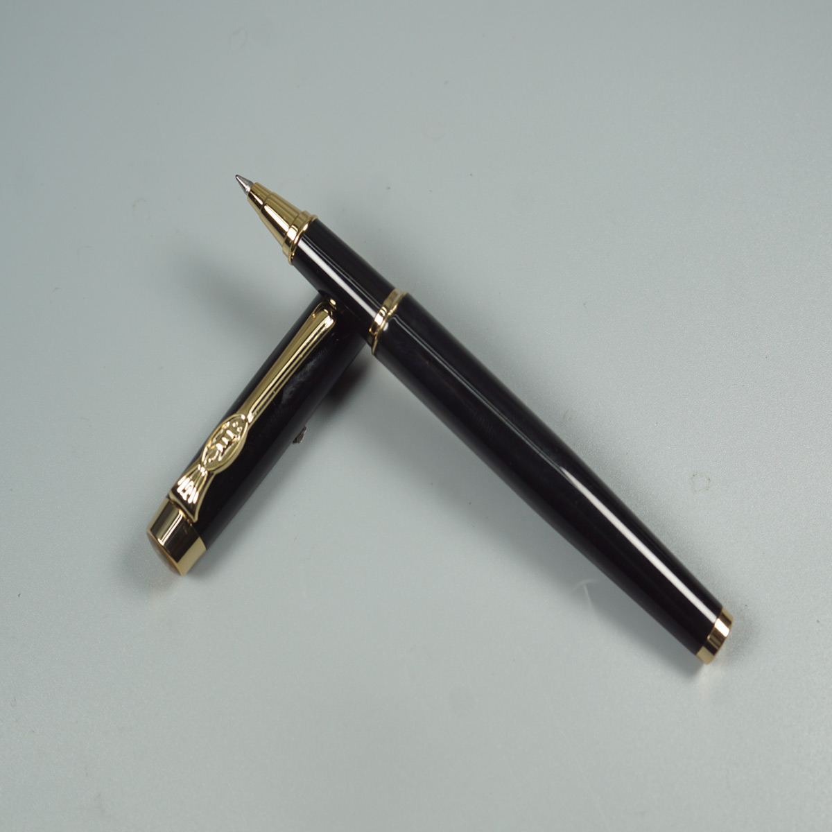 Pimio 933 Glossy Black Color Body and  Cap  with Gold Trims Medium Tipped Roller Ball Pen SKU 28461