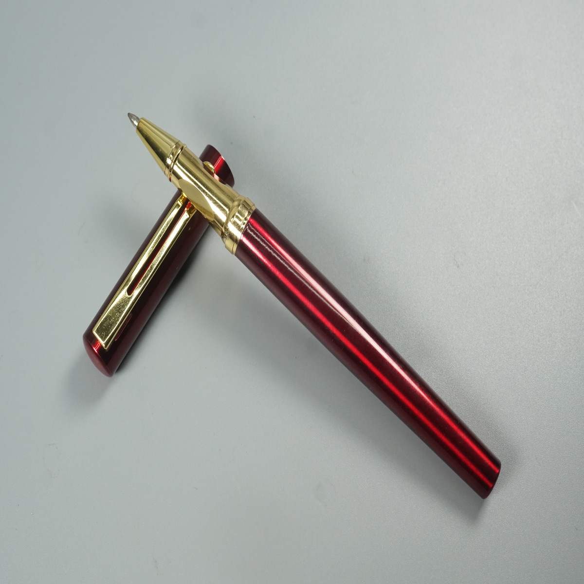 penhouse.in Glossy Red Color Body and Cap Gold Clip and Grip Roller Ball Pen SKU 28528