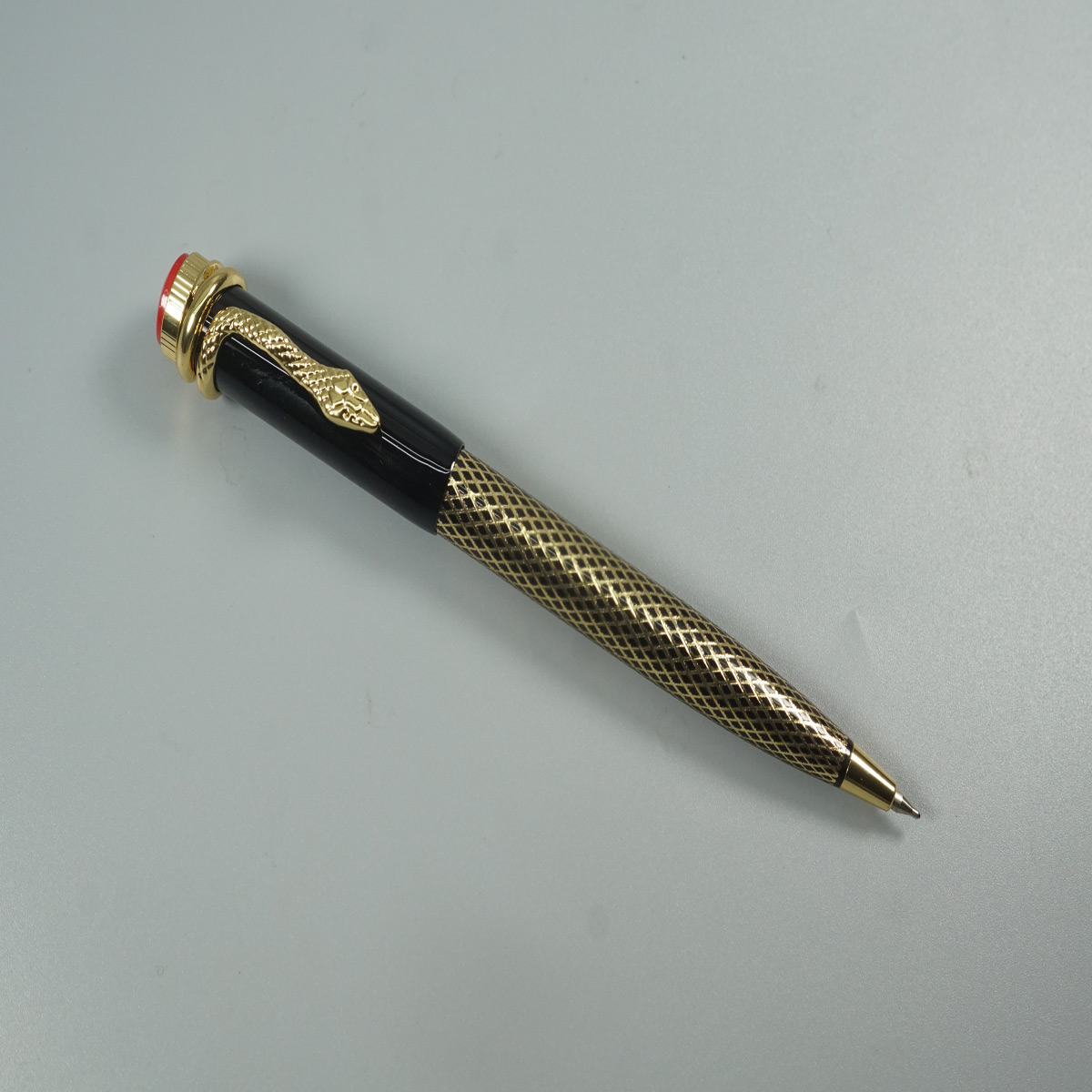 penhouse.in Gold with Black Color Body with Snake Gold Clip Fine Tip Top On Red Twist Type Ball Pen   SKU   28530 28530