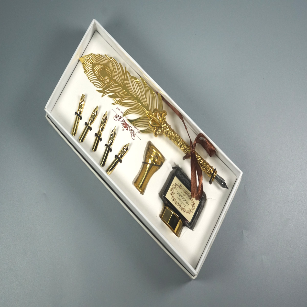 penhouse.in Metal Gold Color Feather Design With Stand and Ink Bottle 5 Calligraphy Nibs Pen Set SKU 28545