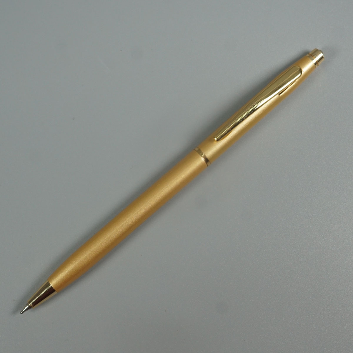 Swiss Cross 1002  Gold Color Body With Gold Color Clip And Top On White Stone Twist Type Ball Pen SKU 28555