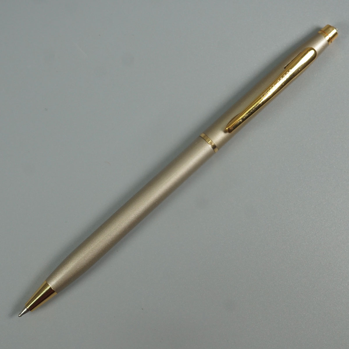 Swiss Cross 1002  Silver Color Body With Gold Color Clip And Top On White Stone Twist Type Ball Pen   SKU 28556