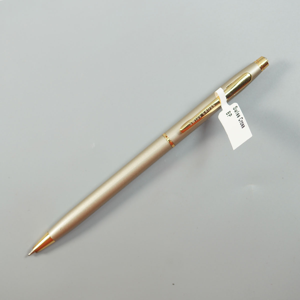 Swiss Cross 1002 Dark Grey Color Body With Gold Color Clip Body Twist Type Ball Pen SKU 28596