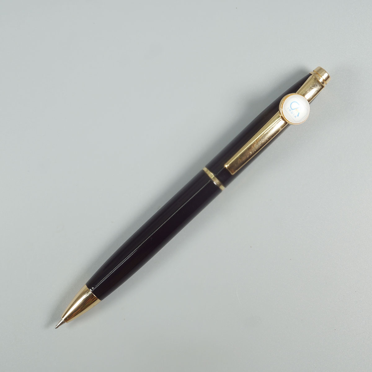 penhouse.in Glossy Black Color Body  With Gold Trim And CA Symbol On Clip Stone On Head Twist Type Ball Pen SKU 28609